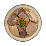 Bollito dei Pastori on stoneware bowl with Beef Broth, Beef Chuck, Carrot