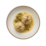 Canederli on stoneware bowl with Bread, Butter, Egg