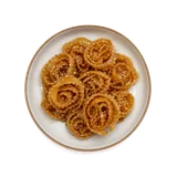Cartellate on stoneware bowl with Cinnamon, Flour, Grape Must