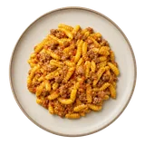 Malloreddus alla Campidanese on stoneware bowl with Malloreddus, Olive Oil, Onion