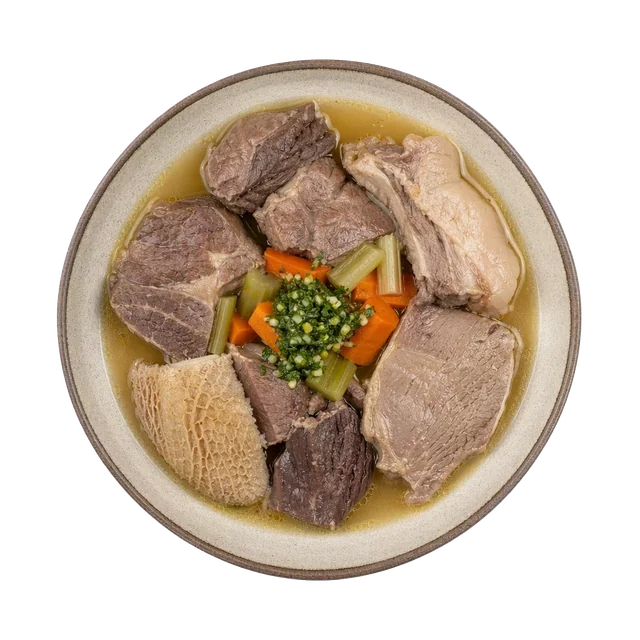Bollito dei Pastori on stoneware bowl with Beef Broth, Beef Chuck, Carrot