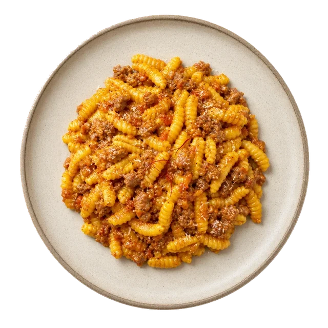 Malloreddus alla Campidanese on stoneware bowl with Malloreddus, Olive Oil, Onion