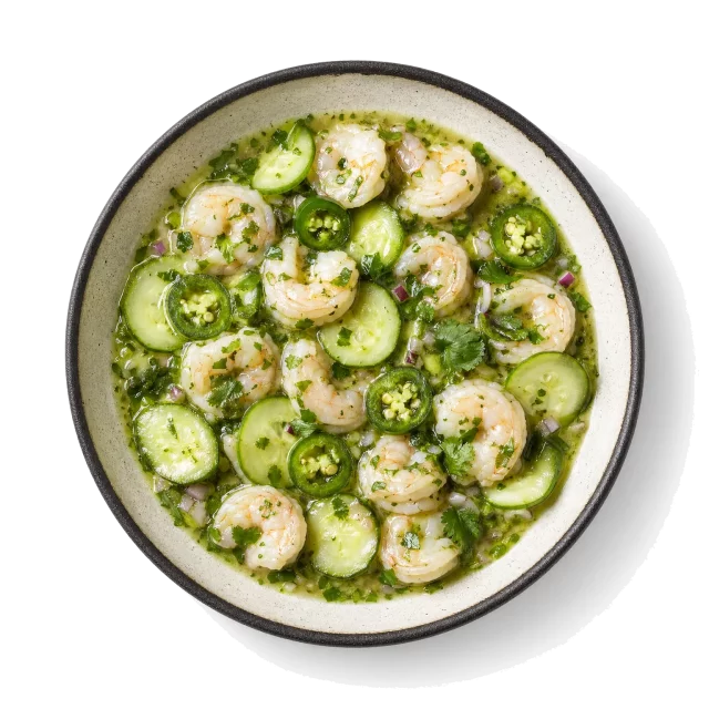Aguachile plated with shrimp, lime, jalapeno