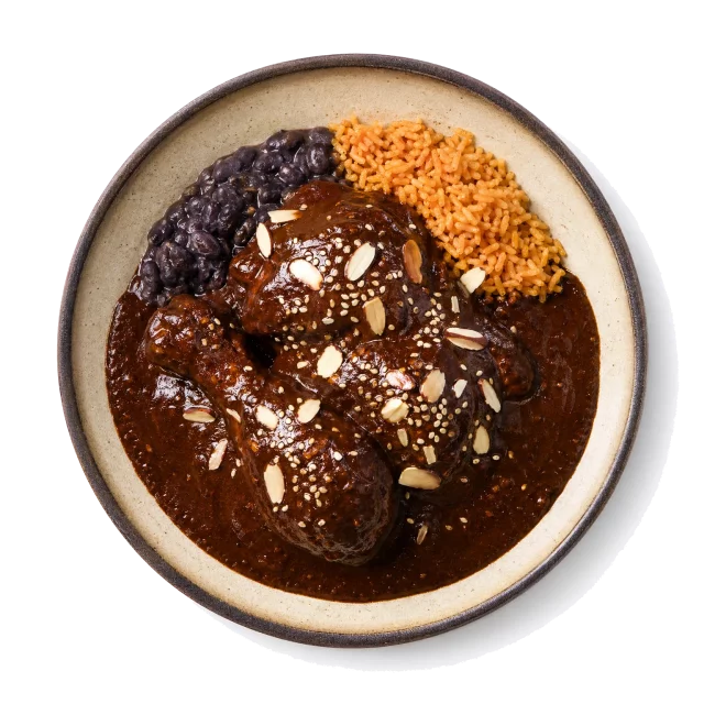 Mole Poblano plated with chocolate, chili, chicken