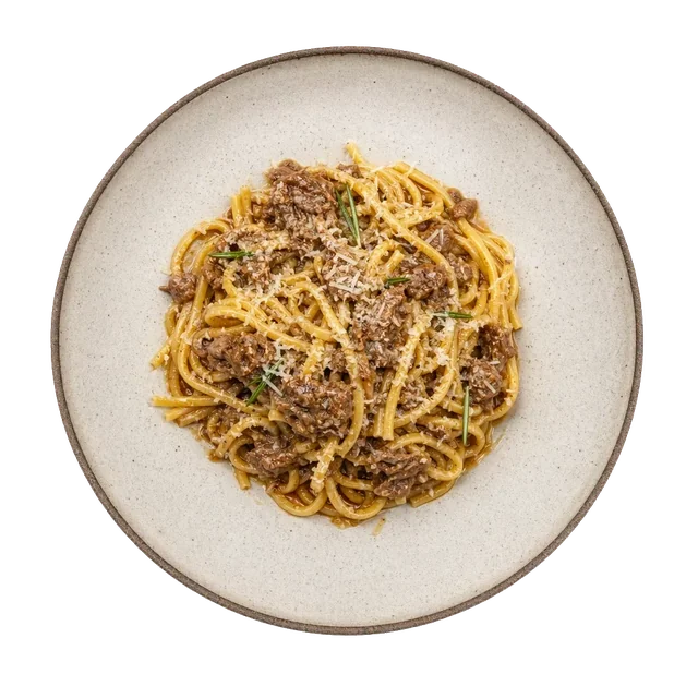 Spaghetti alla chitarra on stoneware bowl with Lamb, Olive Oil, pecorino
