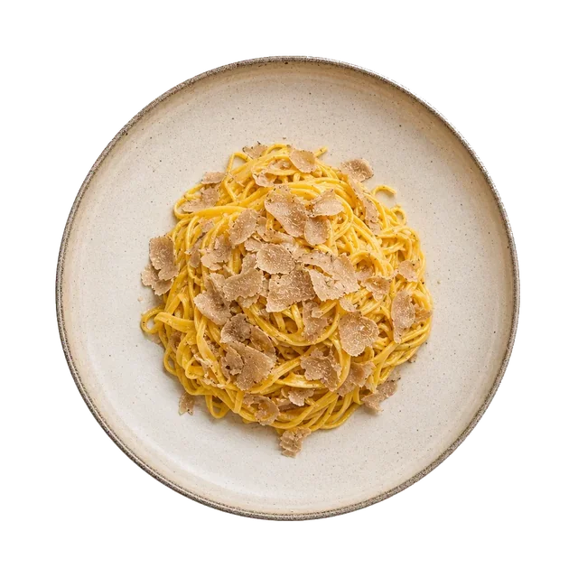 Tajarin al Tartufo on stoneware bowl with Butter, Egg Yolk, parmesan