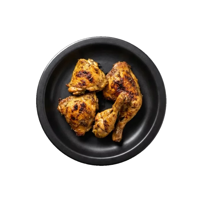 Gai Yang: Thai grilled chicken pieces on a black plate