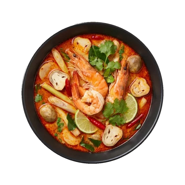 Tom Yum Goong: a spicy and sour Thai creamy soup with whole prawns, mushrooms, lemongrass, galangal, kaff