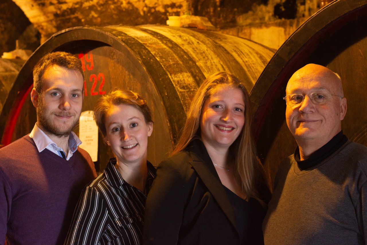 The Marcarini family in the ageing cellar at La Morra