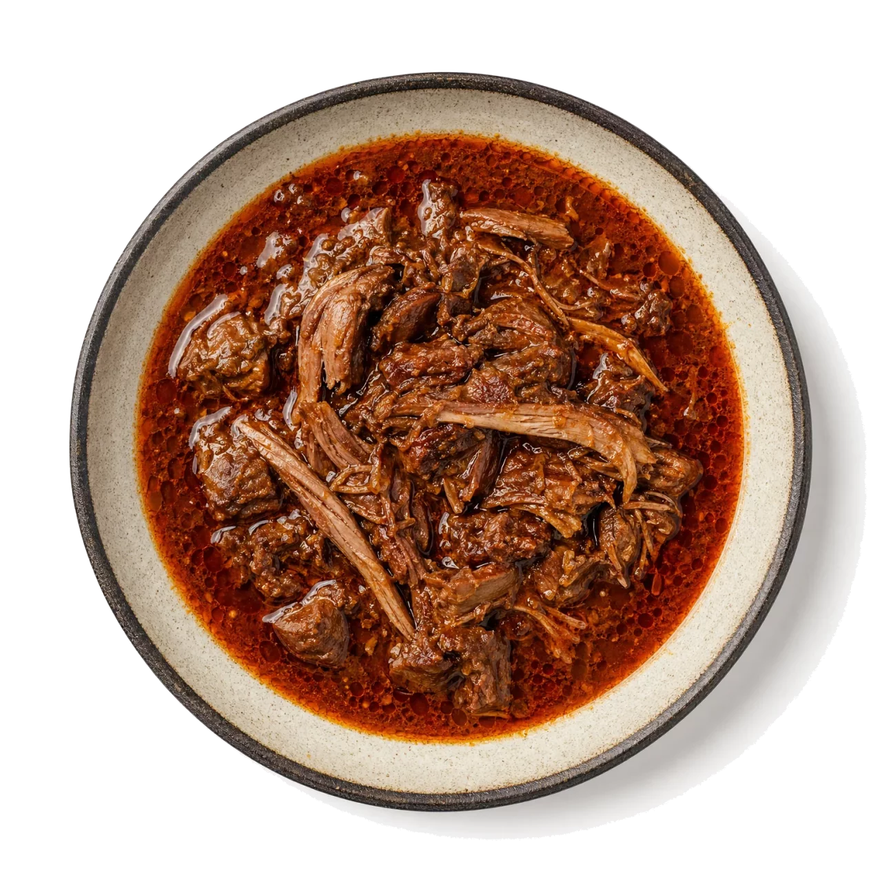 Birria plated with beef, lamb, chili