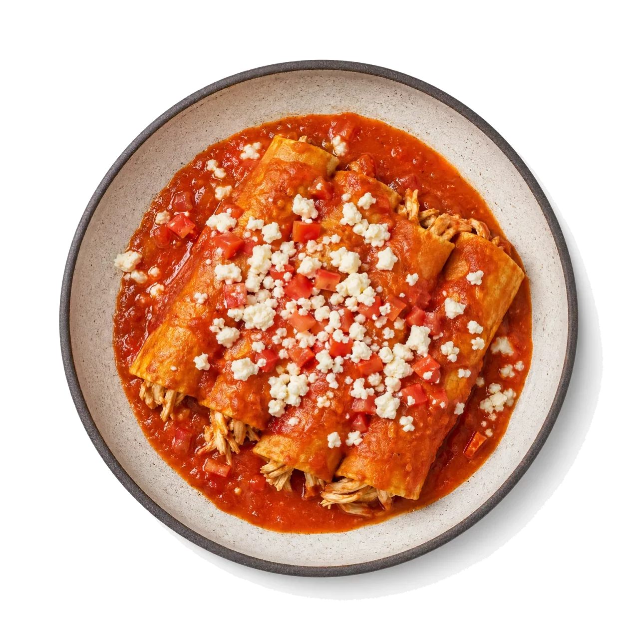 Enchiladas plated with corn tortilla, chicken, tomato