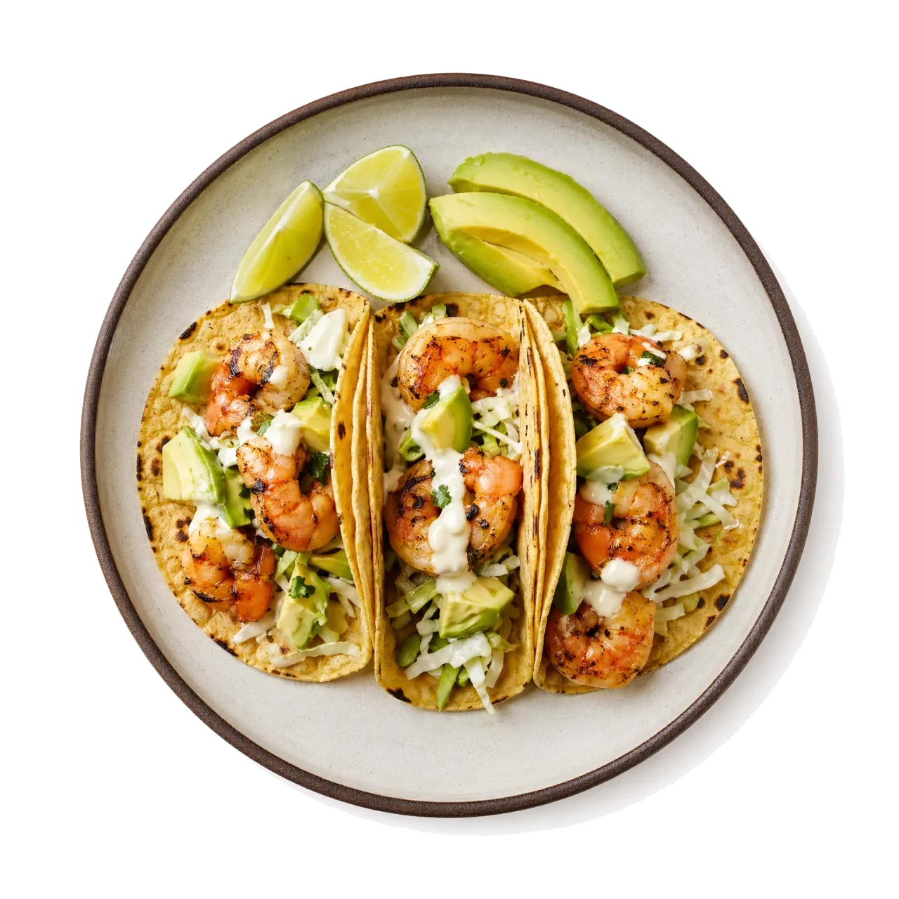 Shrimp Tacos plated with shrimp, corn tortilla, cabbage