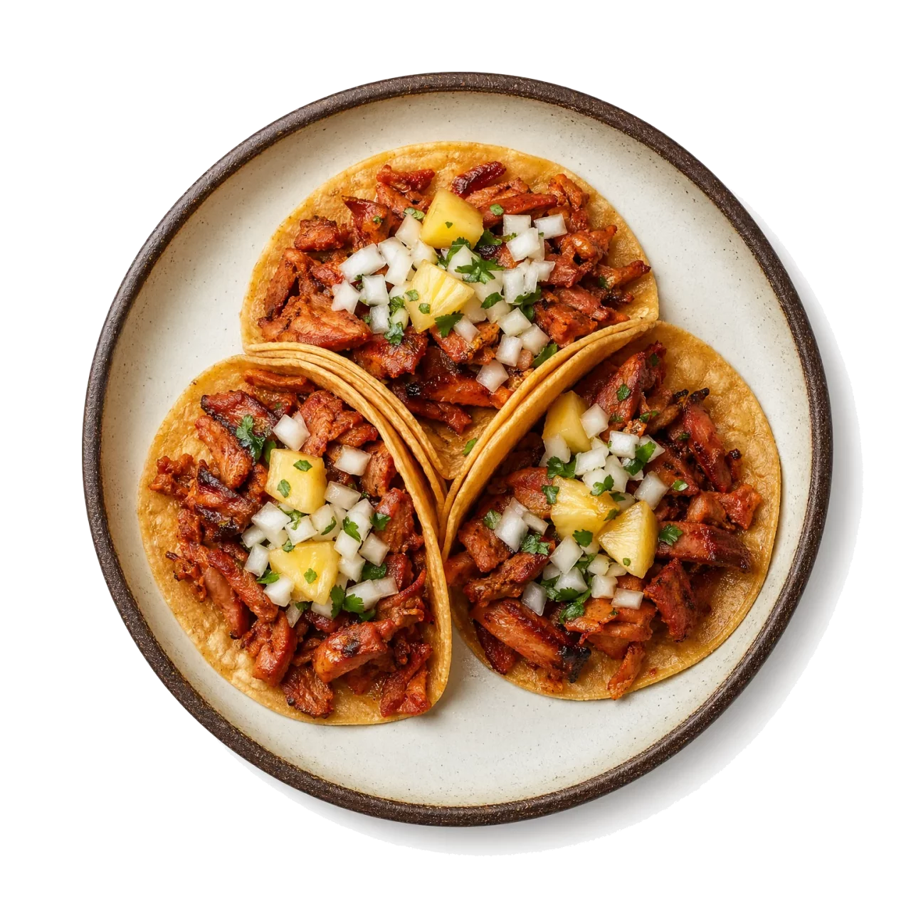 Tacos al Pastor plated with pork, orange peel, corn tortilla