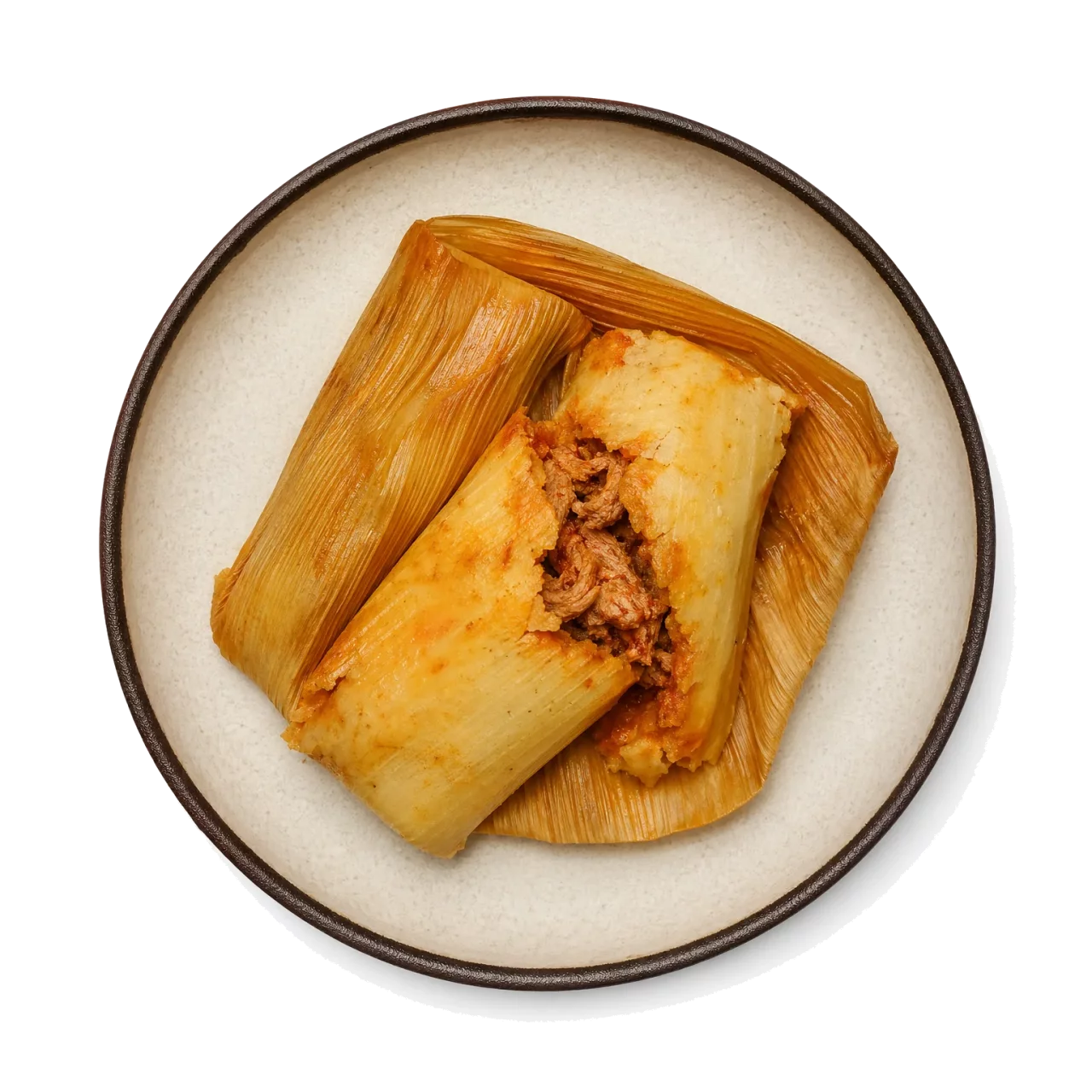 Tamales plated with corn, corn tortilla, pork