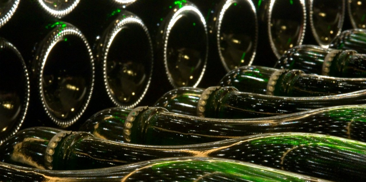 Franciacorta bottles lying on their sides in the Ricci Curbastro cellar