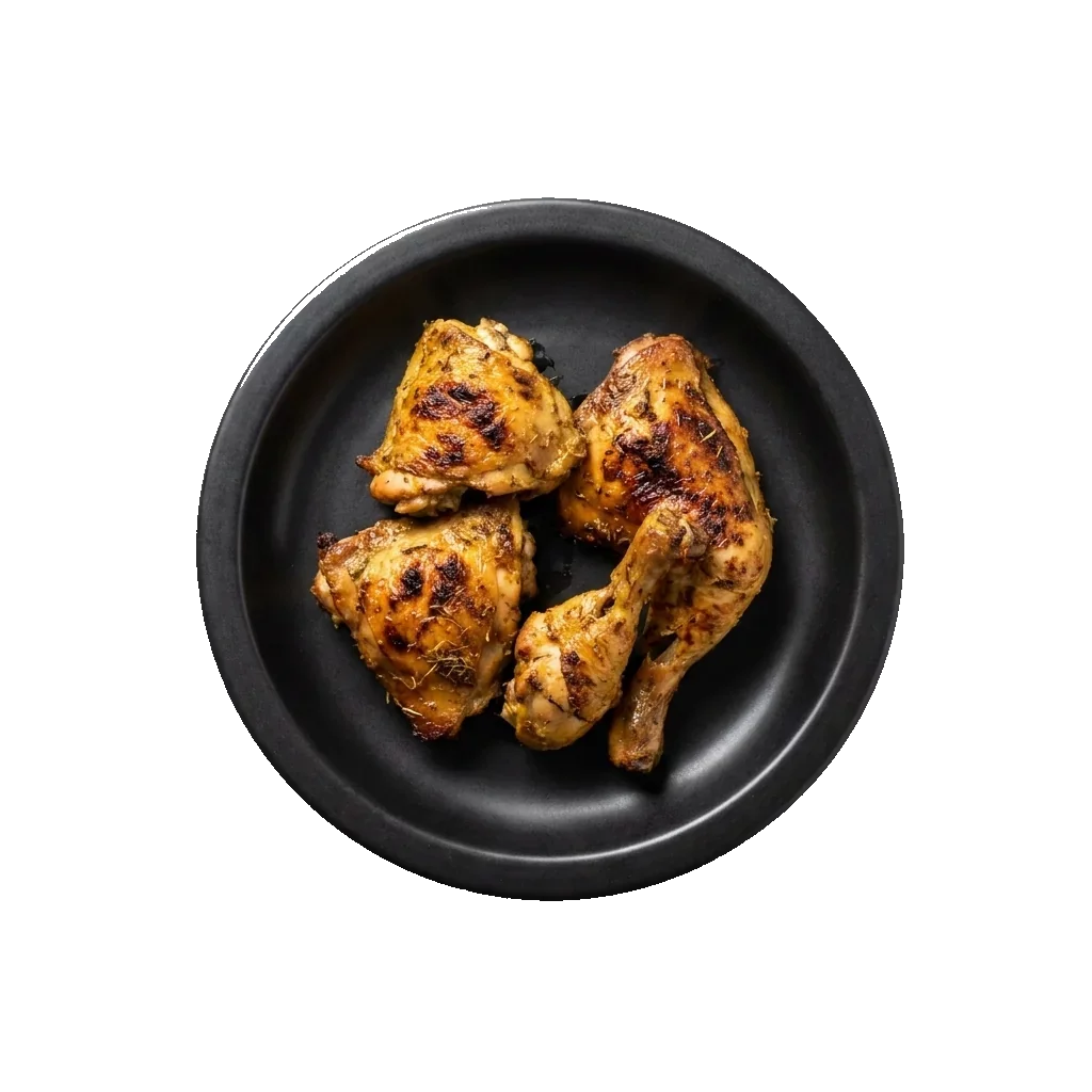 Gai Yang: Thai grilled chicken pieces on a black plate