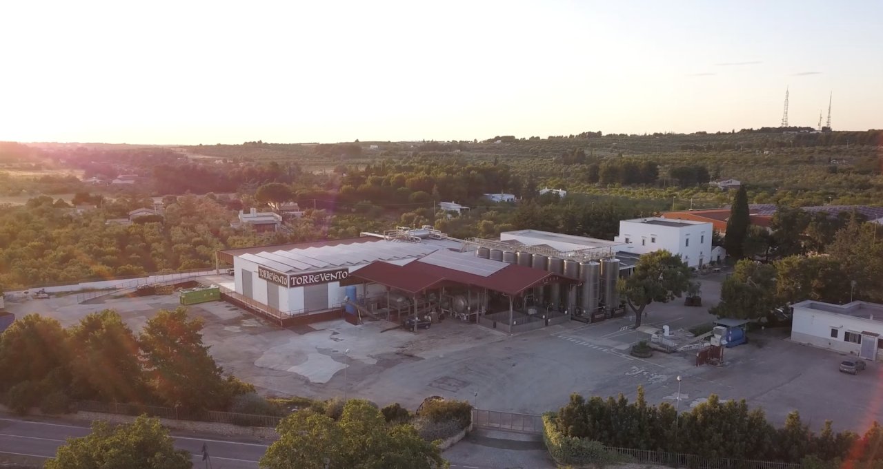 Aerial view of the Torrevento winery buildings at sunset